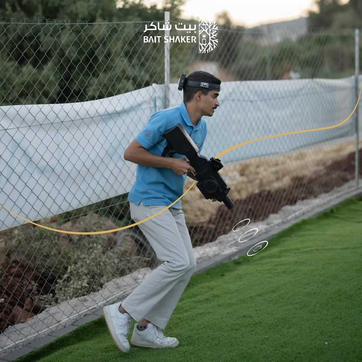 A player running through the outdoor laser tag arena at Bait Shaker