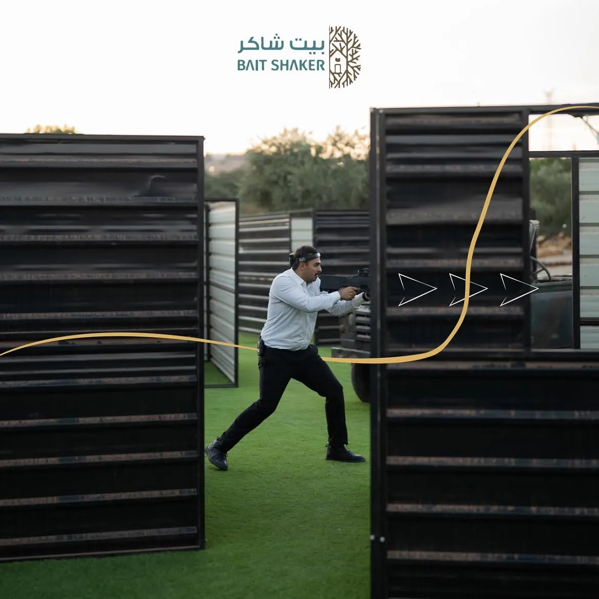 A laser tag player advancing between barriers at Bait Shaker
