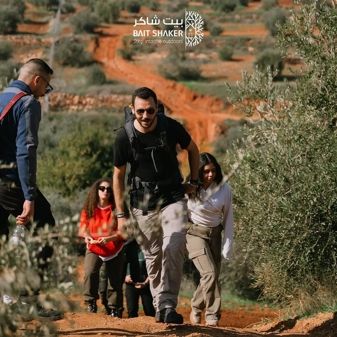 Hikers on a guided trail through the hills at Bait Shaker